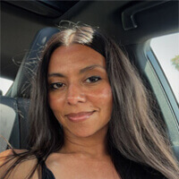 Selfie of a woman in a car, smiling